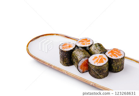 Sushi rolls with salmon on a white plate displayed for enjoyment Sushi rolls with salmon on a white plate displayed for enjoyment 123268631