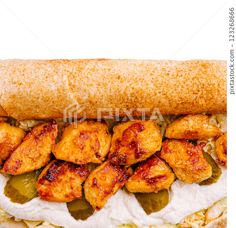 Delicious wrap filled with grilled chicken and fresh toppings 123268666
