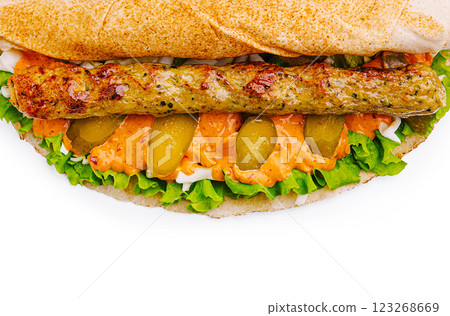Delicious sandwich with grilled meat, fresh vegetables, and sauce 123268669