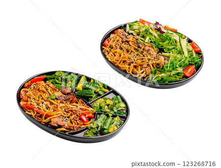 Delicious Asian food platter featuring noodles, vegetables, and salad 123268716