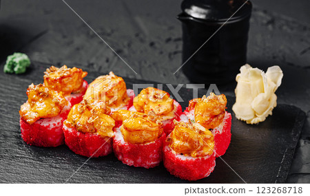 Sushi platter featuring vibrant colored rolls and shrimp topping 123268718