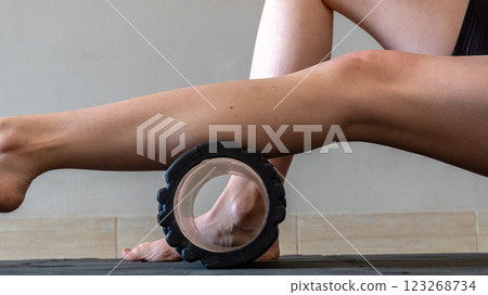 Black MFR roller for body. Recovery massage. MFR roll for rehabilitation and health. Black MFR roller for body. Recovery massage. MFR roll for rehabilitation and health. 123268734