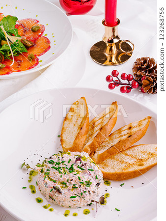 Delicious holiday meal featuring salad and creamy dip with bread 123268756