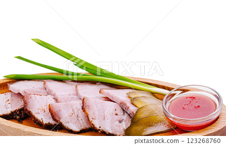 Delicious platter of sliced meat with green onions and sauce 123268760