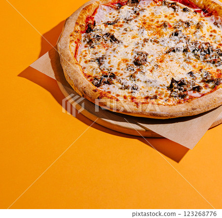 Delicious pizza on a bright orange background 123268776