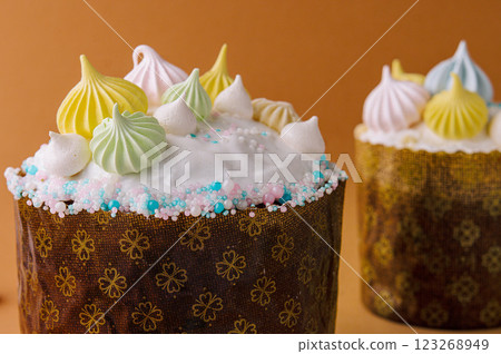 Colorful meringue topped easter cake on festive background 123268949
