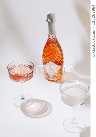 Celebrating with sparkling drinks in elegant glasses Celebrating with sparkling drinks in elegant glasses 123268964