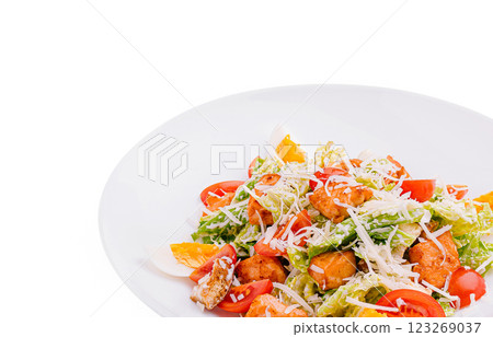 Fresh salad with vegetables and toppings on a white plate 123269037