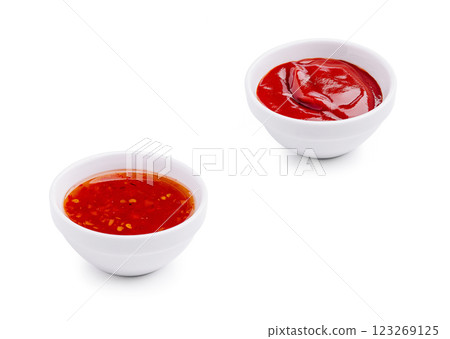 Two small bowls of sauces on a white background ready for dipping 123269125
