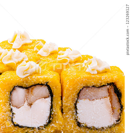 Sushi roll featuring yellow exterior and creamy toppings 123269127