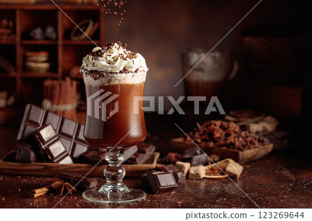 Hot chocolate topped with whipped cream and sprinkled with chocolate chips. Hot chocolate topped with whipped cream and sprinkled with chocolate chips. 123269644