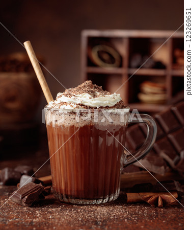Hot chocolate topped with whipped cream and sprinkled with chocolate chips. 123269651