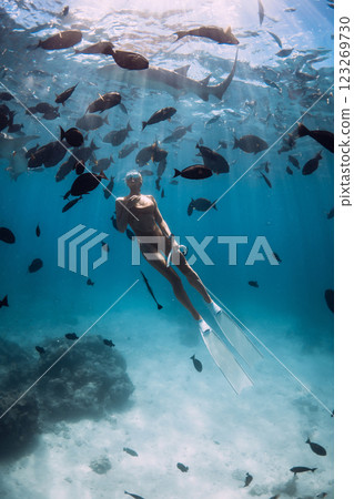 Freediving in a sea with tropical fish and nurse sharks in Maldives 123269730