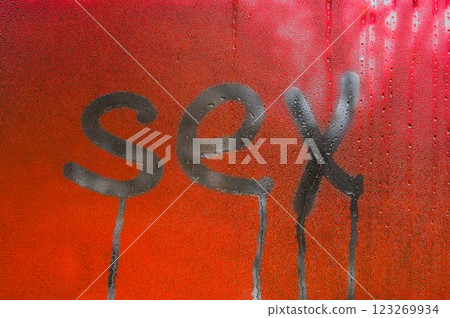 sex writing on glass. red background 123269934