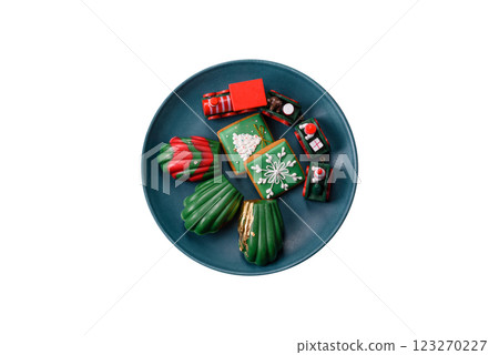 Sweet Madeleines desserts covered with chocolate in Christmas colors 123270227