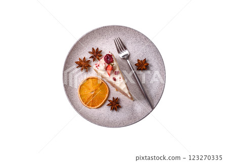 Piece of sweet layer cake with white cream, raspberries and strawberries 123270335