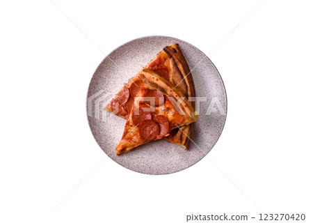 Pepperoni pizza with sausage, mozzarella cheese, tomatoes, salt and spices Pepperoni pizza with sausage, mozzarella cheese, tomatoes, salt and spices 123270420