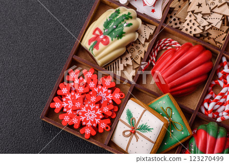 Delicious sweet gingerbread, madeleine biscuits and other elements of Christmas decorations Delicious sweet gingerbread, madeleine biscuits and other elements of Christmas decorations 123270499