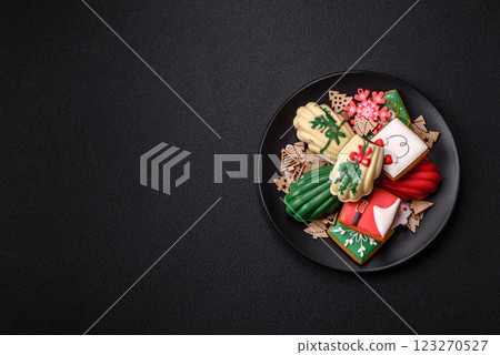 Sweet madeleine sponge cookies covered with colored chocolate 123270527