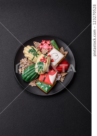 Sweet madeleine sponge cookies covered with colored chocolate 123270528