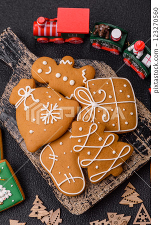Delicious sweet gingerbread, madeleine biscuits and other elements of Christmas decorations Delicious sweet gingerbread, madeleine biscuits and other elements of Christmas decorations 123270560