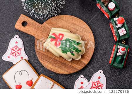 Sweet madeleine sponge cookies covered with colored chocolate 123270586