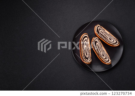 Sweet homemade roll with poppy seeds Sweet homemade roll with poppy seeds 123270734