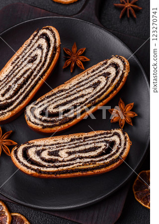 Sweet homemade roll with poppy seeds Sweet homemade roll with poppy seeds 123270741