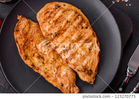 Grilled chicken fillet with salt, spices and herbs 123270775