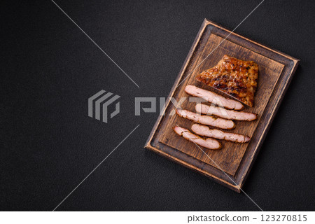 Juicy pork steak baked on the grill with salt, spices and herbs 123270815