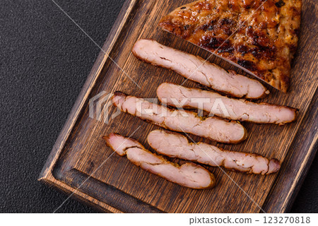 Juicy pork steak baked on the grill with salt, spices and herbs 123270818