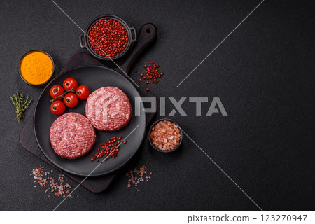 Fresh raw ground beef burger patty with salt and spices 123270947