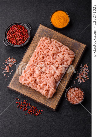 Raw minced chicken with salt, spices and herbs 123271025