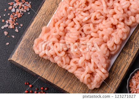 Raw minced chicken with salt, spices and herbs 123271027