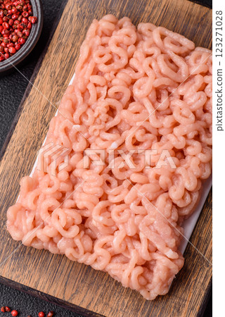 Raw minced chicken with salt, spices and herbs 123271028