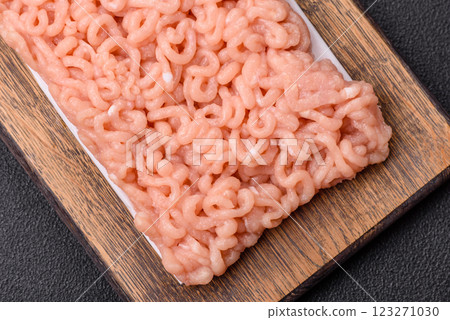 Raw minced chicken with salt, spices and herbs 123271030