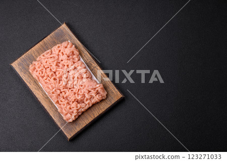 Raw minced chicken with salt, spices and herbs Raw minced chicken with salt, spices and herbs 123271033