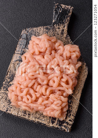 Raw minced chicken with salt, spices and herbs Raw minced chicken with salt, spices and herbs 123271054