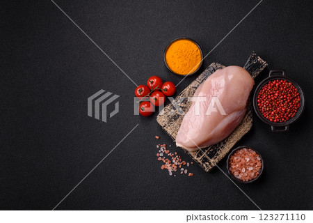 Pieces of raw chicken or turkey fillet with salt, spices and herbs Pieces of raw chicken or turkey fillet with salt, spices and herbs 123271110