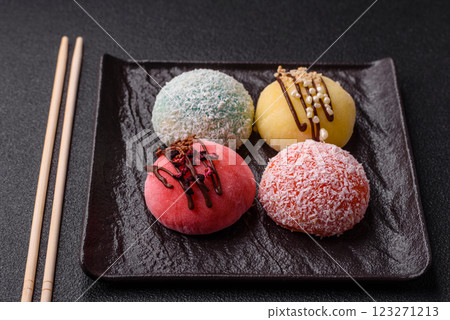 Delicious colorful asian mochi sweets with rice dough shell and fruit filling Delicious colorful asian mochi sweets with rice dough shell and fruit filling 123271213