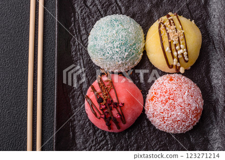 Delicious colorful asian mochi sweets with rice dough shell and fruit filling Delicious colorful asian mochi sweets with rice dough shell and fruit filling 123271214
