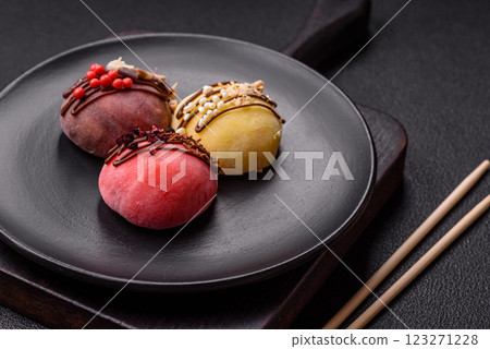Delicious colorful asian mochi sweets with rice dough shell and fruit filling Delicious colorful asian mochi sweets with rice dough shell and fruit filling 123271228