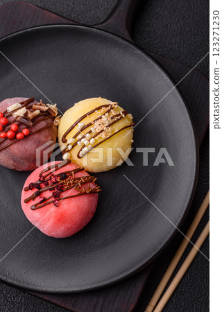 Delicious colorful asian mochi sweets with rice dough shell and fruit filling Delicious colorful asian mochi sweets with rice dough shell and fruit filling 123271230