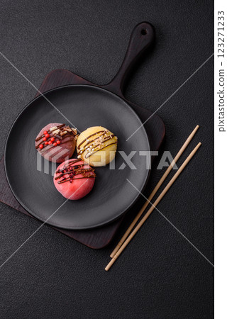 Delicious colorful asian mochi sweets with rice dough shell and fruit filling Delicious colorful asian mochi sweets with rice dough shell and fruit filling 123271233