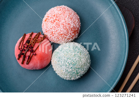 Delicious colorful asian mochi sweets with rice dough shell and fruit filling Delicious colorful asian mochi sweets with rice dough shell and fruit filling 123271241