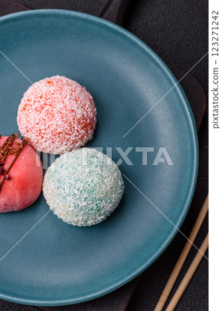 Delicious colorful asian mochi sweets with rice dough shell and fruit filling Delicious colorful asian mochi sweets with rice dough shell and fruit filling 123271242