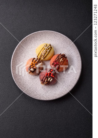 Delicious colorful asian mochi sweets with rice dough shell and fruit filling Delicious colorful asian mochi sweets with rice dough shell and fruit filling 123271248