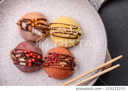 Delicious colorful asian mochi sweets with rice dough shell and fruit filling 123271253