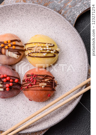 Delicious colorful asian mochi sweets with rice dough shell and fruit filling 123271254