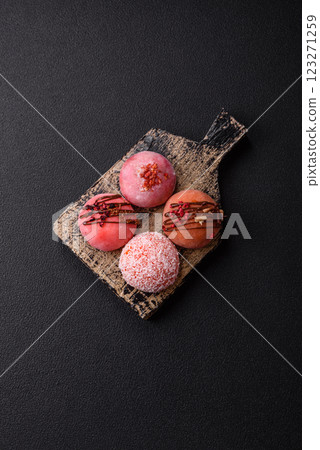 Delicious colorful asian mochi sweets with rice dough shell and fruit filling Delicious colorful asian mochi sweets with rice dough shell and fruit filling 123271259